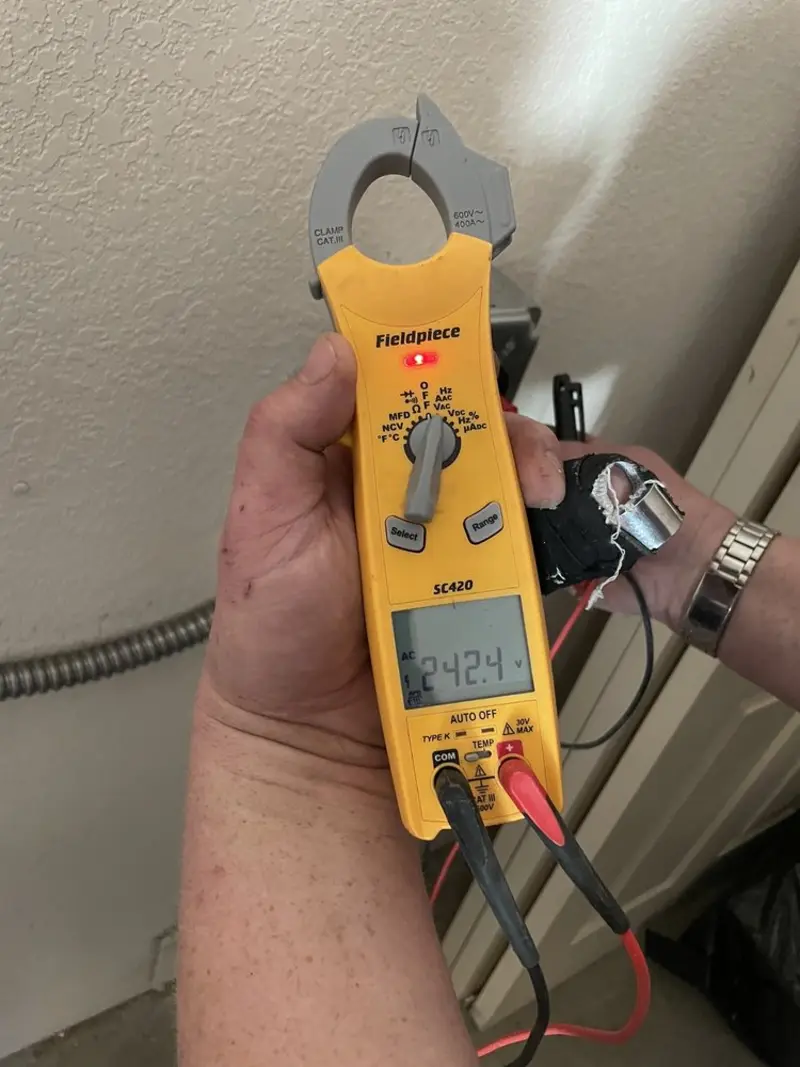 Voltage testing with clamp meter during Recessed Lighting Installation in Ardsley
